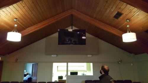 TV Mounted From Vaulted Ceiling in a Church